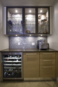 A beverage center with glassware, wine cooler, refrigerated drawers and coffee maker makes parties a breeze.
