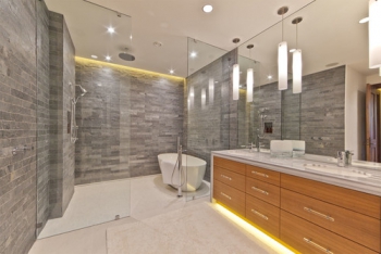 A variety of silhouette lighting gives this contemporary bathroom an edge.